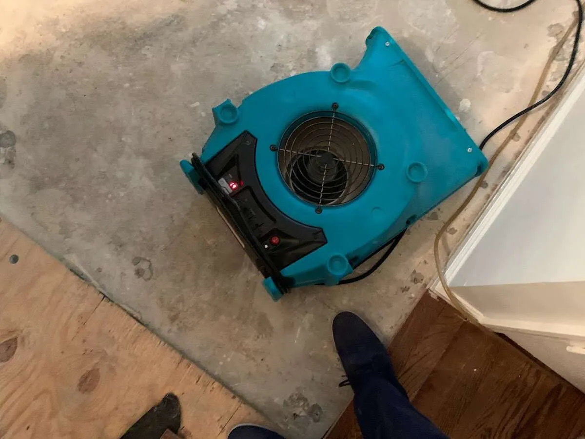 Air mover drying subfloor during Commercial Water Damage Restoration in Ewa Beach