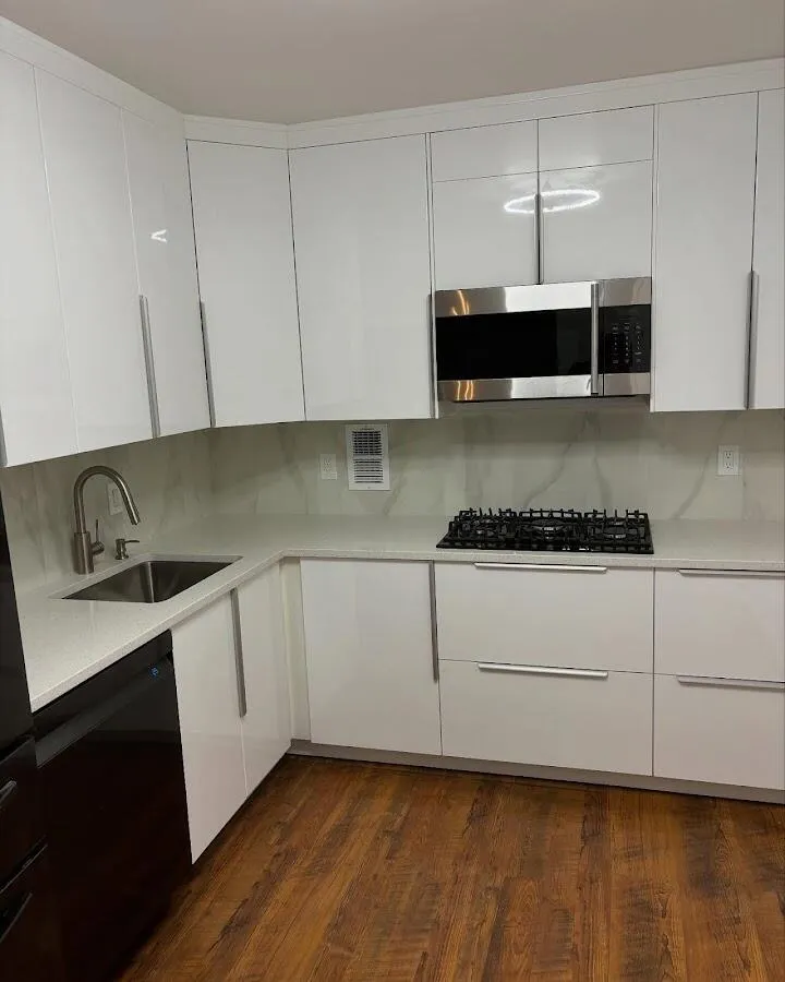 Restored kitchen with white cabinets after water damage in Ewa Beach